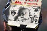 OAKLAND, CA - JANUARY 03:  A fan of the Oakland Raiders looks on against the Baltimore Ravens during an NFL game at Oakland-Alameda County Coliseum on January 3, 2010 in Oakland, California.  (Photo by Jed Jacobsohn/Getty Images)