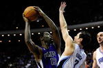 ORLANDO, FL - JANUARY 22:  Tyreke Evans #13 of the Sacramento Kings attempts a shot over J.J. Redick #7 of the Orlando Magic during the game at Amway Arena on January 22, 2010 in Orlando, Florida. NOTE TO USER: User expressly acknowledges and agrees that, by downloading and/or using this Photograph, user is consenting to the terms and conditions of the Getty Images License Agreement.  (Photo by Sam Greenwood/Getty Images)