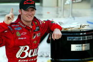 DAYTONA BEACH, FL - FEBRUARY 15: Dale Earnhardt Jr. driver of the #8 DEI Budweiser Chevrolet poses with the Harvey J. Earl Daytona 500 Trophy in victory circle after winning the NASCAR Nextel Cup Daytona 500 on February 15, 2004 at the Daytona International Speedway in Daytona Beach, Florida. (Photo by Robert Laberge/Getty Images)