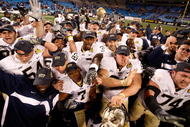 CHARLOTTE, NC - DECEMBER 26: The Pittsburgh Panthers celebrate a 19-17 victory over the North Carolina Tar Heels after their game on December 26, 2009 in Charlotte, North Carolina. (Photo by Streeter Lecka/Getty Images)