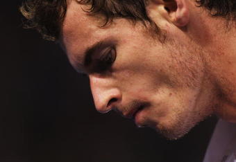 MELBOURNE, AUSTRALIA - JANUARY 31:  Andy Murray of Great Britain reacts after a point in his men's final match against Roger Federer of Switzerland during day fourteen of the 2010 Australian Open at Melbourne Park on January 31, 2010 in Melbourne, Australia.  (Photo by Ryan Pierse/Getty Images)