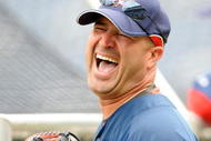 WASHINGTON - APRIL 19:  Manager Manny Acta of the Washington Nationals laughs with players before the game against the Florida Marlins at Nationals Park April 19, 2009 in Washington, DC.  (Photo by Greg Fiume/Getty Images)