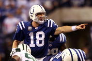 INDIANAPOLIS - JANUARY 24: Quarterback Peyton Manning #18 of the Indianapolis Colts under center during the second half against the New York Jets during the AFC Championship Game at Lucas Oil Stadium on January 24, 2010 in Indianapolis, Indiana. The Colts defeated the Jets 30-17. (Photo by Elsa/Getty Images)
