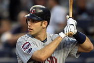 NEW YORK - OCTOBER 09: Joe Mauer #7 of the Minnesota Twins bats against the New York Yankees in Game Two of the ALDS during the 2009 MLB Playoffs at Yankee Stadium on October 9, 2009 in the Bronx borough of New York City. (Photo by Jim McIsaac/Getty Images)