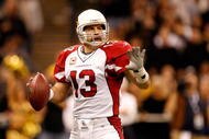NEW ORLEANS - JANUARY 16:  Quarterback Kurt Warner #13 of the Arizona Cardinals looks to pass against the New Orleans Saints during the NFC Divisional Playoff Game at Louisana Superdome on January 16, 2010 in New Orleans, Louisiana. The Saints won 45-14.  (Photo by Ronald Martinez/Getty Images)