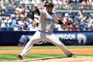 NEW YORK - JULY 06: Ricky Romero #24 of the Toronto Blue Jays pitches against the New York Yankees on July 6, 2009 at Yankee Stadium in the Bronx borough of New York City. (Photo by Jim McIsaac/Getty Images)