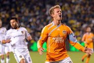 CARSON, CA - NOVEMBER 13:  Stuart Holden #22 of the Houston Dynamo is kicked by Gregg Berhalter #16 Los Angeles Galaxy in the first half during the 2009 MLS Western Conference Championship at The Home Depot Center on November 13, 2009 in Carson, California.  (Photo by Kevork Djansezian/Getty Images)