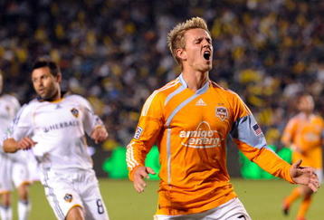 CARSON, CA - NOVEMBER 13:  Stuart Holden #22 of the Houston Dynamo is kicked by Gregg Berhalter #16 Los Angeles Galaxy in the first half during the 2009 MLS Western Conference Championship at The Home Depot Center on November 13, 2009 in Carson, California.  (Photo by Kevork Djansezian/Getty Images)