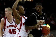 MADISON, WI - JANUARY 27: JaJaun Johnson #33 of the Purdue Boilermakers moves against Trevon Hughes #3 of the Wisconsin Badgers on January 27, 2009 at the Kohl Center in Madison, Wisconsin. Purdue defeated Wisconsin 64-63. (Photo by Jonathan Daniel/Getty Images)