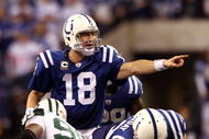 INDIANAPOLIS - JANUARY 24: Quarterback Peyton Manning #18 of the Indianapolis Colts under center during the second half against the New York Jets during the AFC Championship Game at Lucas Oil Stadium on January 24, 2010 in Indianapolis, Indiana. The Colts defeated the Jets 30-17. (Photo by Elsa/Getty Images)
