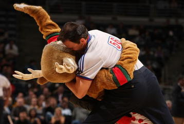 MILWAUKEE - FEBRUARY 13: Referee Mark Ayotte #56 plants a kiss on Bango, the Milwaukee Bucks mascot, during a game between the Bucks and the New Orleans Hornets February 13, 2008 at the Bradley Center in Milwaukee, Wisconsin. NOTE TO USER: User expressly acknowledges and agreees that, by downloading and/or using this Photograph, User is consenting to the terms and conditions of the Getty Images License Agreement. (Photo by Jonathan Daniel/Getty Images)