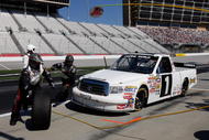 HAMPTON, GA - MARCH 07: Johnny Benson, driver of the #1 Red Horse Racing Toyota, pits during the NASCAR Craftsman Truck Series American Commercial Lines 200 at the Atlanta Motor Speedway on March 7, 2009 in Hampton, Georgia. (Photo by John Harrelson/Getty Images)