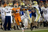 TAMPA, FL - DECEMBER 05: Running back Andre Ellington #23 of the Clemson Tigers is knocked out of bounds by defenders Mario Butler #2 and Mario Edwards #33 of the Georgia Tech Yellow Jackets in the 2009 ACC Football Championship game at Raymond James Stadium on December 5, 2009 in Tampa, Florida. (Photo by J. Meric/Getty Images)