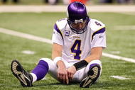 NEW ORLEANS - JANUARY 24: Brett Favre #4 of the Minnesota Vikings sits on the turf after getting knocked down on a play against the New Orleans Saints during the NFC Championship Game at the Louisana Superdome on January 24, 2010 in New Orleans, Louisiana. (Photo by Ronald Martinez/Getty Images)