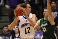 EVANSTON, IL - JANUARY 02: Luka Mirkovic #12 of the Northwestern Wildcats looks to pass as Garrick Sherman #41 of the Michigan State Spartans defends on January 2, 2010 at Welsh-Ryan Arena in Evanston, Illinois.  Michigan State defeated Northwestern 91-70.  (Photo by Jonathan Daniel/Getty Images)