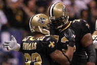 NEW ORLEANS - JANUARY 24:  Pierre Thomas #23 of the New Orleans Saints celebrates with teammate Jahri Evans #73 after scoring a touchdown on a 38-yard pass play in the first quarter against the Minnesota Vikings during the NFC Championship Game at the Louisiana Superdome on January 24, 2010 in New Orleans, Louisiana.  (Photo by Jed Jacobsohn/Getty Images)