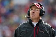 JACKSONVILLE, FL - JANUARY 01: Offensive coordinator and future head coach Jimbo Fisher of the Florida State Seminoles walks the sidelines while taking on the West Virginia Mountaineers during the Konica Minolta Gator Bowl on January 1, 2010 at Jacksonville Municipal Stadium in Jacksonville, Florida. Florida State defeated West Virginia 33-21 in Bobby Bowden's last game as a head coach for the Seminoles. (Photo by Doug Benc/Getty Images)