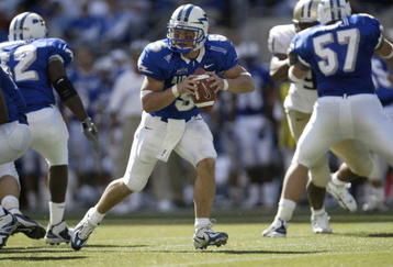 SEATTLE - SEPTEMBER 3:  Quarterback Shaun Carney #5 of Air Force rolls out to pass against the Washington Huskies on September 3, 2005 at Quest Field in Seattle, Washington. (Photo by Otto Greule Jr/Getty Images) 