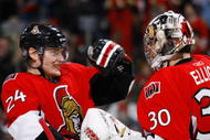 OTTAWA, ON - JANUARY 19: Anton Volchenkov #24 of the Ottawa Senators celebrates with teammate Brian Elliott #30 after a 4-1 victory over the Chicago Blackhawks in a game at Scotiabank Place on January 19, 2010 in Ottawa, Canada. (Photo by Phillip MacCallum/Getty Images)
