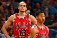 NEW ORLEANS - JANUARY 29: Joakim Noah #13 and Derrick Rose #1 of the Chicago Bulls during the game against the New Orleans Hornets at the New Orleans Arena on January 29, 2010 in New Orleans, Louisiana. NOTE TO USER: User expressly acknowledges and agrees that, by downloading and/or using this Photograph, User is consenting to the terms and conditions of the Getty Images License Agreement. (Photo by Chris Graythen/Getty Images)