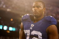EAST RUTHERFORD, NJ - NOVEMBER 08: Osi Umenyiora #72 of the New York Giants leaves the field after a loss to the San Diego Chargers at Giants Stadium on November 8, 2009 in East Rutherford, New Jersey. (Photo by Nick Laham/Getty Images)