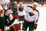 GLENDALE, AZ - JANUARY 16:  Guillaume Latendresse #48 of the Minnesota Wild celebrates with teammates on the bench after scoring a second period goal against the Phoenix Coyotes during the NHL game at Jobing.com Arena on January 16, 2010 in Glendale, Arizona.  (Photo by Christian Petersen/Getty Images)