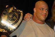 NEW YORK - MARCH 18:  World Wrestling Entertainment Wrestlers Kurt Angle (L) and Triple H attend a media conference announcing the all-star lineup of WWE WrestleMania XIX at ESPN Zone in Times Square March 18, 2003 in New York City.  (Photo by Mark Mainz/Getty Images)