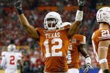 GLENDALE, AZ - JANUARY 05:  Cornerback Earl Thomas #12 of the Texas Longhorns celebrates a defensive stop against Brian Robiskie #80 of the Ohio State Buckeyes during the Tostitos Fiesta Bowl Game on January 5, 2009 at University of Phoenix Stadium in Glendale, Arizona.  (Photo by Jeff Gross/Getty Images)