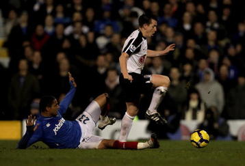 LONDON, ENGLAND - FEBRUARY 03:   Nicky Shorey of Fulham is tackled by Kevin-Prince Boateng of Portsmouth during the Barclays Premier League match between Fulham and Portsmouth at Craven Cottage on February 3, 2010 in London, England.  (Photo by Hamish Blair/Getty Images)