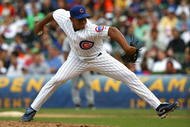 CHICAGO - AUGUST 28: Carlos Marmol #49 of the Chicago Cubs pitches in the 9th inning against the New York Mets on August 28, 2009 at Wrigley Field in Chicago, Illinois. The Cubs defeated the Mets 5-2. (Photo by Jonathan Daniel/Getty Images)