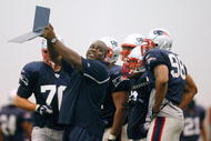 FOXBORO, MA - JULY 24: Defensive Line Coach Pepper Johnson of the New England Patriots provides instruction in a drill during the first day of training camp at Gillette Stadium on July 24, 2008 in Foxboro, Massachusetts. (Photo by Jim Rogash/Getty Images)