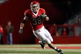 PISCATAWAY, NJ - NOVEMBER 12:  Joe Martinek #38 of the Rutgers Scarlet Knights runs the ball against the South Florida Bulls at Rutgers Stadium on November 12, 2009 in Piscataway, New Jersey. Rutgers won the game 31-0.  (Photo by Jim McIsaac/Getty Images)