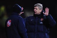 LONDON, ENGLAND - JANUARY 03:  Arsene Wenger the Arsenal manager talks with the fourth official on the touchline during the FA Cup sponsored by E.ON 3rd Round match between West Ham United and Arsenal at the Boleyn Ground on January 3, 2010 in London, England.  (Photo by Shaun Botterill/Getty Images)
