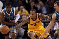 OAKLAND, CA - JANUARY 27: Monta Ellis #8 of the Golden State Warriors and Chris Paul #3 of the New Orleans Hornets scramble for a loose ball at Oracle Arena on January 27, 2010 in Oakland, California. NOTE TO USER: User expressly acknowledges and agrees that, by downloading and/or using this Photograph, user is consenting to the terms and conditions of the Getty Images License Agreement. (Photo by Ezra Shaw/Getty Images)