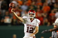 MIAMI GARDENS, FL - OCTOBER 03:  Quarterback Landry Jones #12 of the Oklahoma Sooners throws a pass against the Miami Hurricanes at Land Shark Stadium on October 3, 2009 in Miami Gardens, Florida. Miami defeated Oklahoma 21-20.  (Photo by Doug Benc/Getty Images)