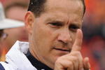 TAMPA, FL - JANUARY 1: Coach Gene Chizik of the Auburn Tigers leaves the field with a win against the Northwestern Wildcats in the Outback Bowl January 1, 2010 at Raymond James Stadium in Tampa, Florida.  (Photo by Al Messerschmidt/Getty Images) 