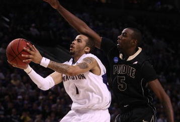 PORTLAND, OR - MARCH 21:  Venoy Overton #1 of the Washington Huskies goes up for a shot against Keaton Grant #5 of the Purdue Boilermakers in the first half during the second round of the NCAA Division I Men's Basketball Tournament at the Rose Garden on March 21, 2009 in Portland, Oregon.  (Photo by Jonathan Ferrey/Getty Images)