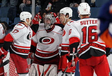 UNIONDALE, NY - FEBRUARY 06:  Justin Peters #60 of the Carolina Hurricanes celebrates his victory against the New York Islanders with teammate Rod Brind'Amour #17 on February 6, 2010 at Nassau Coliseum in Uniondale, New York.  (Photo by Jim McIsaac/Getty Images)