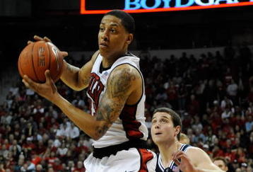 LAS VEGAS - FEBRUARY 06:  Tre'Von Willis #33 of the UNLV Rebels catches a pass in front of Jimmer Fredette; #32 of the Brigham Young University Cougars during their game at the Thomas & Mack Center February 6, 2010 in Las Vegas, Nevada. UNLV won 88-74.  (Photo by Ethan Miller/Getty Images)