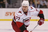 BOSTON - MAY 01: Joe Corvo #77 of the Carolina Hurricanes looks to pass the puck against the Boston Bruins during Game One of the Eastern Conference Semifinal Round of the 2009 Stanley Cup Playoffs on May 1, 2009 at the TD Banknorth Garden in Boston, Massachusetts. The Bruins defeated the Hurricanes 4-1. (Photo by Elsa/Getty Images)