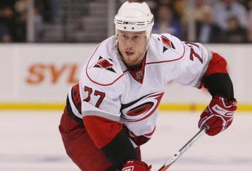 BOSTON - MAY 01:  Joe Corvo #77 of the Carolina Hurricanes looks to pass the puck against the Boston Bruins during Game One of the Eastern Conference Semifinal Round of the 2009 Stanley Cup Playoffs on May 1, 2009 at the TD Banknorth Garden in Boston, Massachusetts. The Bruins defeated the Hurricanes 4-1.  (Photo by Elsa/Getty Images)