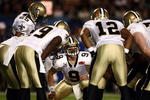 MIAMI GARDENS, FL - FEBRUARY 07: Quarterback Drew Brees #9 of the New Orleans Saints huddles with his team against the Indianapolis Colts during Super Bowl XLIV on February 7, 2010 at Sun Life Stadium in Miami Gardens, Florida.  (Photo by Donald Miralle/Getty Images)