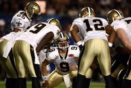 MIAMI GARDENS, FL - FEBRUARY 07: Quarterback Drew Brees #9 of the New Orleans Saints huddles with his team against the Indianapolis Colts during Super Bowl XLIV on February 7, 2010 at Sun Life Stadium in Miami Gardens, Florida.  (Photo by Donald Miralle/Getty Images)
