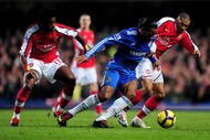LONDON, ENGLAND - FEBRUARY 07: Didier Drogba of Chelsea battles for the ball with Alexandre Song and Gael Clichy of Arsenal during the Barclays Premier League match between Chelsea and Arsenal at Stamford Bridge on February 7, 2010 in London, England. (Photo by Mike Hewitt/Getty Images)