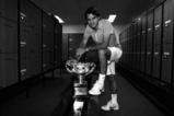 MELBOURNE, AUSTRALIA - JANUARY 31:  (EDITORS NOTE: Image has been converted to black and white.) Roger Federer of Switzerland poses with the Norman Brookes Challenge Cup in the players locker room after winning the men's final match against Andy Murray of Great Britain during day fourteen of the 2010 Australian Open at Melbourne Park on January 31, 2010 in Melbourne, Australia.  (Photo by Clive Brunskill/Getty Images)