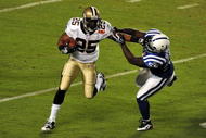 MIAMI GARDENS, FL - FEBRUARY 07: Reggie Bush #25 of the New Orleans Saints runs with the ball against  Clint Session #55 of the Indianapolis Colts during Super Bowl XLIV on February 7, 2010 at Sun Life Stadium in Miami Gardens, Florida.  (Photo by Larry French/Getty Images)