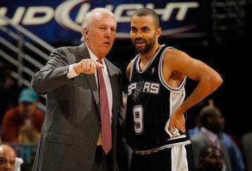 NEW ORLEANS - JANUARY 18:  Head coach Gregg Popovich and Tony Parker #9 of the San Antonio Spurs talk during a timeout against the New Orleans Hornets at New Orleans Arena on January 18, 2010 in New Orleans, Louisiana.   NOTE TO USER: User expressly acknowledges and agrees that, by downloading and/or using this Photograph, User is consenting to the terms and conditions of the Getty Images License Agreement.  (Photo by Chris Graythen/Getty Images)