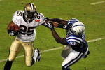 MIAMI GARDENS, FL - FEBRUARY 07: Reggie Bush #25 of the New Orleans Saints runs with the ball against  Clint Session #55 of the Indianapolis Colts during Super Bowl XLIV on February 7, 2010 at Sun Life Stadium in Miami Gardens, Florida.  (Photo by Larry French/Getty Images)
