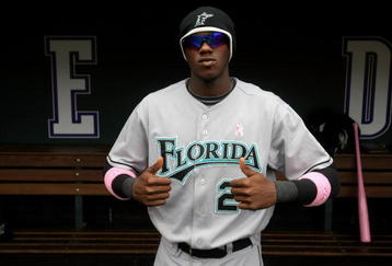 DENVER - MAY 10:  Cameron Maybin #24 of the Florida Marlins shows off his pink accessories in support of the 'Going To Bat Against Breast Cancer' promotion prior to facing the Colorado Rockies during MLB action at Coors Field on May 10, 2009 in Denver, Colorado.  (Photo by Doug Pensinger/Getty Images)