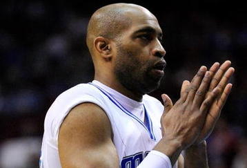 ORLANDO, FL - JANUARY 22:  Vince Carter #15 of the Orlando Magic applauds during the game against the Sacramento Kings at Amway Arena on January 22, 2010 in Orlando, Florida. NOTE TO USER: User expressly acknowledges and agrees that, by downloading and/or using this Photograph, user is consenting to the terms and conditions of the Getty Images License Agreement.  (Photo by Sam Greenwood/Getty Images)